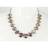 A Georgian gilt metal and amethyst necklace, composed of oval cut amethysts, 20.90g.