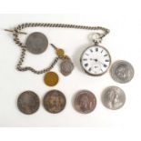 A silver pocket watch with a silver Albert chain and fob together with a group of crowns to