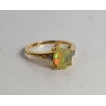 A 9ct gold, opal and white zircon ring, with the Certificate of Authenticity.