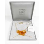 A Lalique cloud pendant necklace, in the original presentation box.