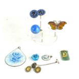 A vintage blue enamel and silver ball pendant, a floral enamel pendant, a butterfly enamel brooch, a