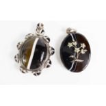 A Victorian agate and silver plated on brass pendant, the central cabochon bordered by eight smaller