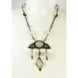 A vintage moonstone, and silver pendant necklace, the various sized moonstones within silver