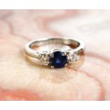 A platinum, sapphire and diamond trilogy ring, size O, 5.8g.