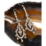 A pair of white metal and old cut diamond drop earrings, harebells and foliate design, 6cm long,