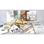 A group of Beatles LPs and 7" single records, some first pressings to include Rubber Soul,