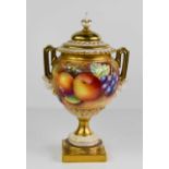 A Royal Worcester vase and cover, signed Leaman, with twin mask handles painted with fruit to a