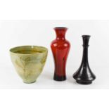A bronze trumpet form vase decorated with silvered inlaid stylised flowers, a red glass vase and a