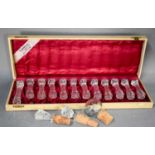 A Jungerhans of Rotterdam boxes set of twelve cut glass vintage knife rests, together with three