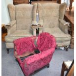 A pair of Victorian wingback armchairs, raised on oak ball and claw feet together with a childs