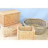 A vintage wicker oval basket together with two wicker picnic baskets and a small log basket.