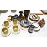 A selection of Mid-century studio style pottery, including four J&G Meakin teacups and saucers,