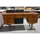 A Mid-Century teak effect dressing table, mirrors included.