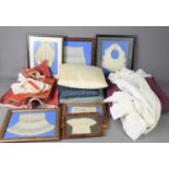 A group of framed antique lace to include a child's bib, bonnet and two cuffs together with a