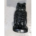 A cast iron door stop in the form of an owl.