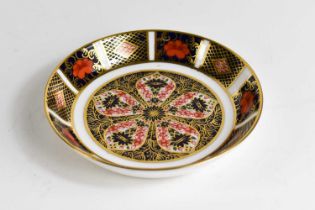 A Royal Crown Derby dish in the Imari pattern 1128, 11cm diameter.
