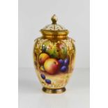 A Royal Worcester pot pourri vase and cover painted with panels of fruit by Moseley, puce mark 1932,