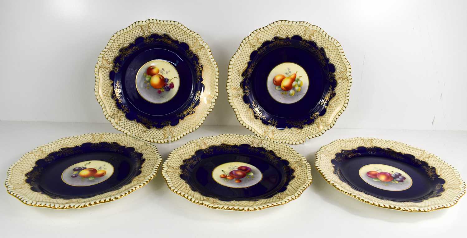 A set of five Royal Worcester plates by E Townsend, painted to the centres with fruit, cobalt blue