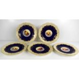 A set of five Royal Worcester plates by E Townsend, painted to the centres with fruit, cobalt blue