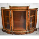 A French 19th century walnut, ormolu and marble topped credenza, with shaped bow front, central