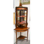 An Edwardian rosewood and marquetry inlaid corner cabinet, witha bow front glazed foor, satinwood