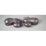 Two soapstone carvings in the form of hippopotamus, each 20cm long, together with a group of corals,