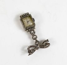 A vintage Bucherer silver and marcasite set brooch watch, with a bow form top, stamped 800 grade. [