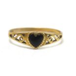 A 9ct gold sweetheart ring, set with a jet heart with scroll shoulders, size N, 1.04g.