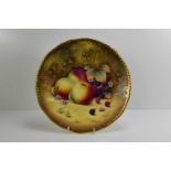 A fine Royal Worcester plate, painted with apples, blackberries, red berries, flowers and autumn