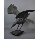A metalwork sculpture, in the form of a crow with outspread wings, 60cm high.