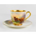 A Royal Worcester cup & saucer, by Harry Stinton, painted with Highland cattle with gilded interior,