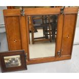 An Edwardian mahogany coat rack mirror, having quarter sectioned veneer with bicolour quatrefoil