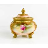 A Royal Worcester pot pourri vase and cover, painted with roses, raised on three feet, 13cm high.The