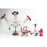 A Victorian epergne, the plated stand holding three curved, flared glass trumpets with violet