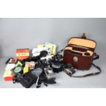 A group of vintage cameras and lenses to include an Olympus 35RC, Asahi Pentax Sportmatic II and