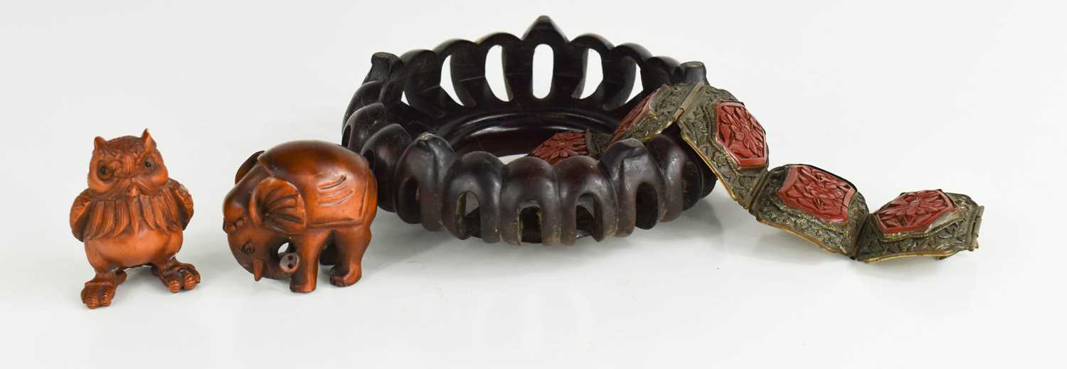 Two Japanese inro carved beads, together with a cinnabar and metalwork bracelet, and a hardwood