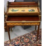 A 19th century French Bonheur du jour with tambour top enclosing three fitted drawers above a hand
