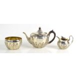 A Victorian silver tea for one, comprising of a tea pot, sugar bowl and creamer, 12.26toz,