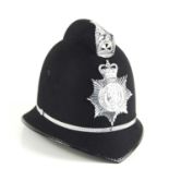 A vintage Mid-Anglia Constabulary police helmet, made by Christy's of London.
