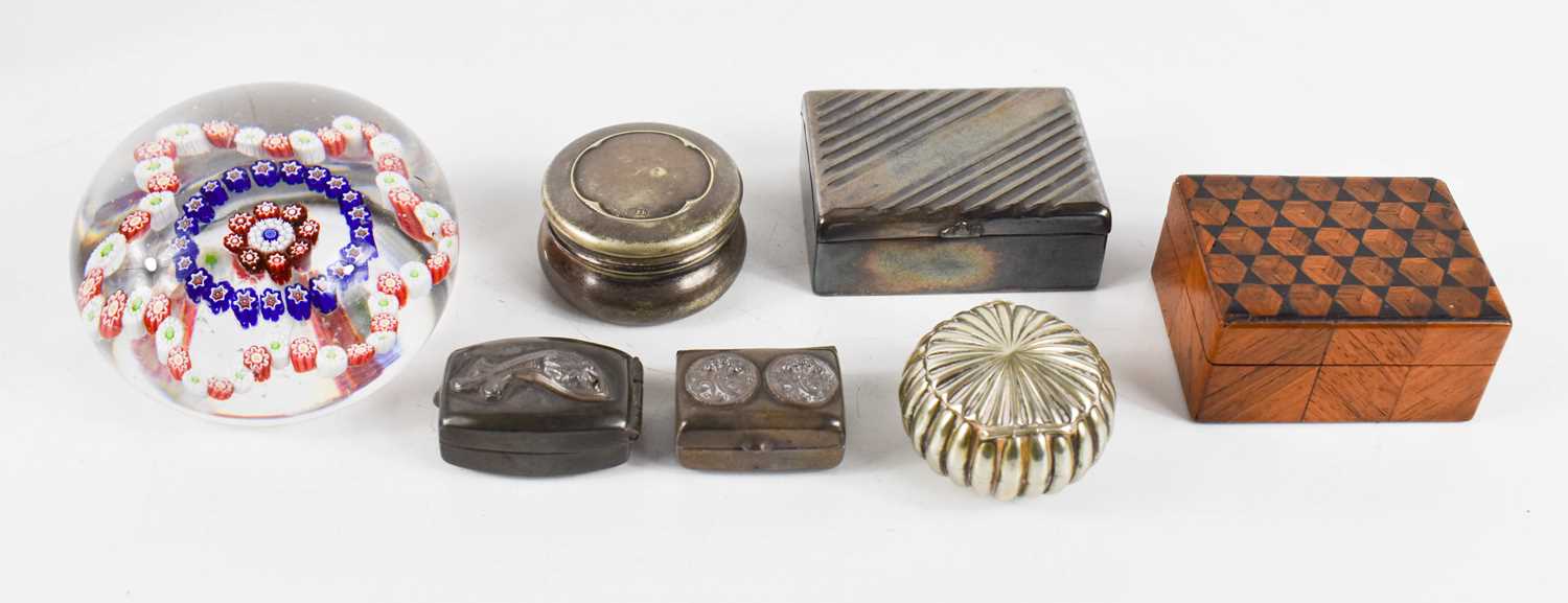 A collection of six snuff boxes including a late 19th century Indian silver example, a Chinese