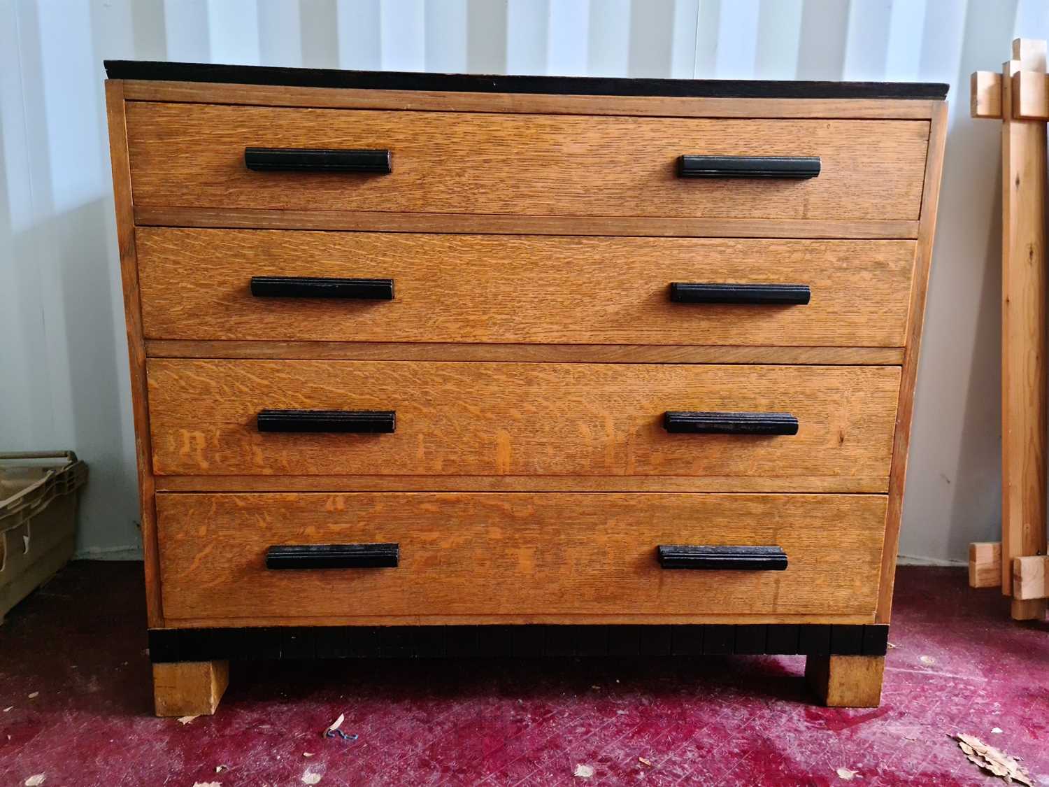 An Art Deco period oak chest of drawers.
