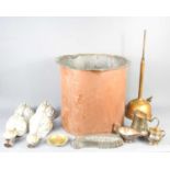 A large copper cauldron, 38cm high, together with four antique ball and claw feet for roll top bath,