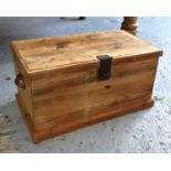 A small pine chest with cup handles to the sides and drop in trays, 26cm high by 50cm by 27cm.