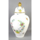A large lidded urn by Herend Porcelain Hungary, the vase hand painted with floral sprays, 59cm