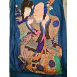 An early 20th century Chinese wall hanging, the embroidered figures in various colour and golden