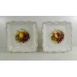 A pair of Royal Worcester square dishes, painted with fruit to the centre, by Roberts, with