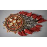 An antique Chinese wall hanging, with red and gold mirrored centre, bordered by lucky medallions