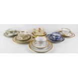 A selection of porcelain tea cup and saucer trios, to include Bavarian and German examples.