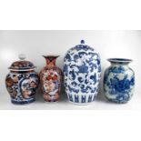 A group of four Chinese vases, one blue and white example with cover, two Imari style examples,