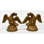 A pair of cast iron doorstops, in the form of eagles with outspread wings, 18cm high.